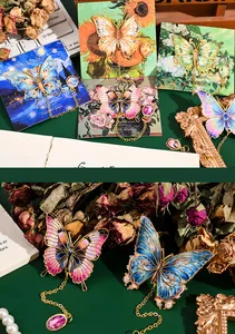 Close-up of intricate metal butterfly bookmarks with gold chains and colorful gemstone charms