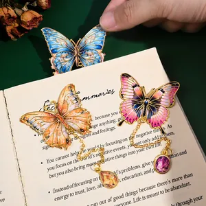 Set of elegant metal butterfly bookmarks featuring colorful enamel wings and pendants