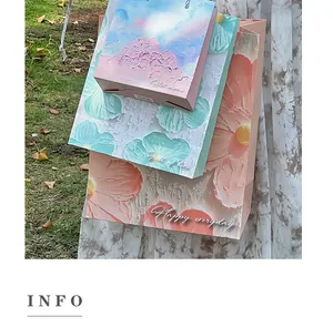 Macro view of artistic oil painting style gift bags with elegant floral patterns.
