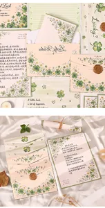 Detailed view of plant-themed stationery set with clover patterns and wax seals