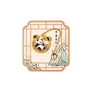 Decorative metal panda bookmark with gold chain and apple charm in gift packaging