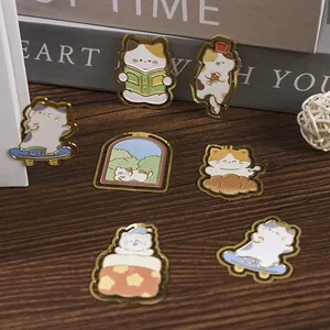 A collection of cute cartoon cat metal bookmarks for students and reading enthusiasts.
