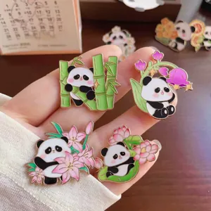 Set of four adorable cartoon panda enamel pins with various floral and bamboo details