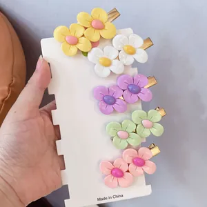 Set of sweet candy-colored flower hair clips on a white display card for girl accessories