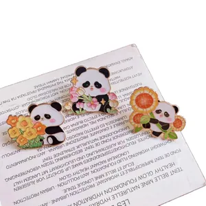Set of three cute cartoon panda enamel pins with colorful flowers for backpack decoration