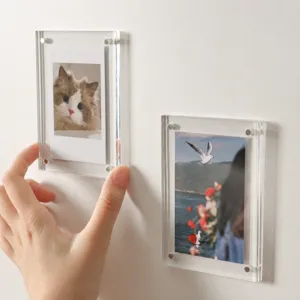 Detailed view of clear acrylic magnetic photo frame showing the magnetic attachment