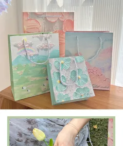 Creative high-end oil painting gift bag set with elegant landscape and flower patterns.