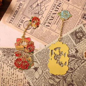Vintage floral metal bookmarks with enamel rose and birdcage charms for books