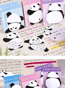 Detailed view of cartoon panda sticky notes used for vocabulary learning in a notebook