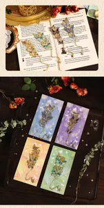 Close-up of vintage metal butterfly bookmarks with intricate enamel wing details and chains.