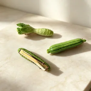 Detailed close-up showing realistic green vegetable hair clips on marble backdrop