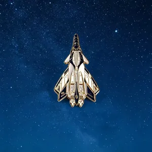 Close-up view of a fighter jet enamel pin with gold plating on a starry galaxy background