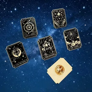 Detailed view of tarot card enamel pins with gold accents on starry background