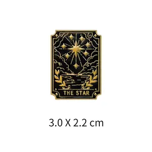 Detail of The Star tarot card enamel pin featuring gold and black plating, 3.0 x 2.2 cm.