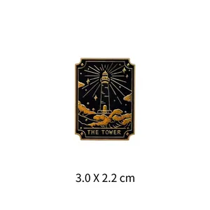 Detailed view of The Tower Tarot card enamel pin badge in gold and black finish, 3.0 x 2.2 cm