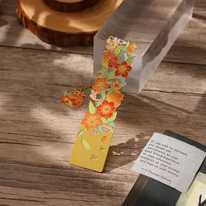 Elegant hollow floral metal bookmark with pomegranate motif and golden finish for reading
