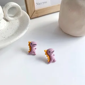 Boucles d'oreilles dinosaures violets mignons avec touches jaunes pour filles