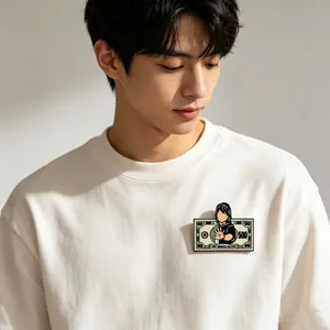 Close-up of a funny cartoon singer metal brooch pin on a white sweatshirt detail