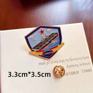 Detail view of an enamel aircraft carrier lapel pin with 3.3cm by 3.5cm measurements.