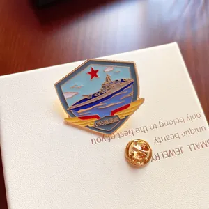Detailed close-up view of a Type 055 destroyer enamel brooch on a white jewelry box