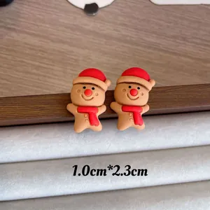 Close-up detail of cute Christmas gingerbread man stud earrings, size 1.0cm*2.3cm.