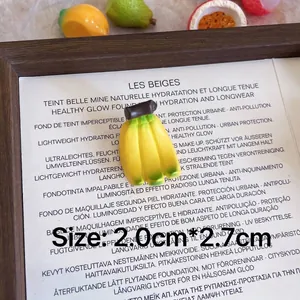 Close-up macro detail of a 3D resin banana brooch with 2.0cm by 2.7cm dimensions