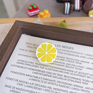 Detailed view of a realistic 3D resin lemon fruit brooch pin for clothing accessories