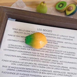 Close-up of a 3D resin fruit brooch with yellow green gradient and 2.0x1.7cm size.