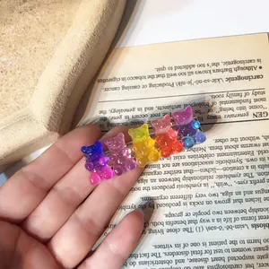 Close-up detail of a colorful resin gummy bear hair clip with sparkling glitter finish