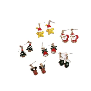 Adorable set of cartoon Christmas stud earrings featuring Santa, reindeer and bells