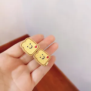 Close-up of cute simulated toast hair clips with smiling faces and hearts
