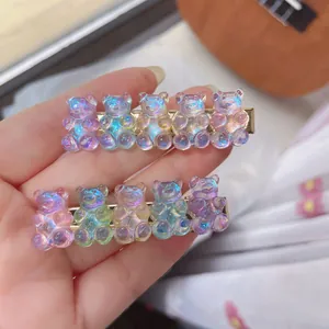 Close-up of cute candy-colored resin gummy bear hair clips with holographic finish