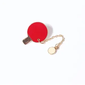 Creative red ping pong racket brooch with gold dangling chain and miniature ball