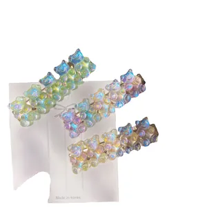 Set of three cute transparent iridescent gummy bear hair clips in sweet candy colors