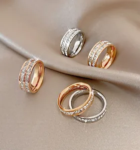 Close-up detail view of multi-colored full diamond star rings on elegant soft silk fabric