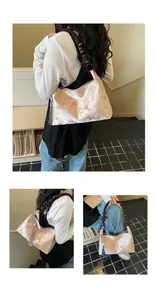 Detail shots of a New Chinese style floral satin handbag featuring a wooden bead handle.