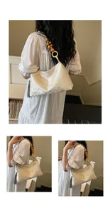 Neo-Chinese style jacquard shoulder bag with wooden bead strap and tassel detail
