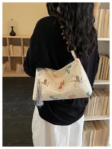 Detailed back view of a model carrying a New Chinese style butterfly underarm bag