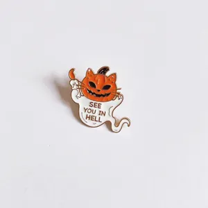 Detailed close-up view of a Halloween ghost enamel pin featuring a pumpkin cat head