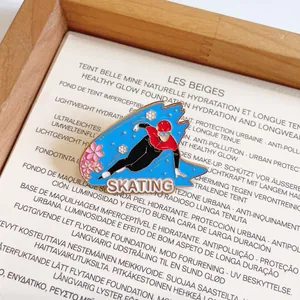 Detailed view of an enamel pin depicting a speed skater with Skating text