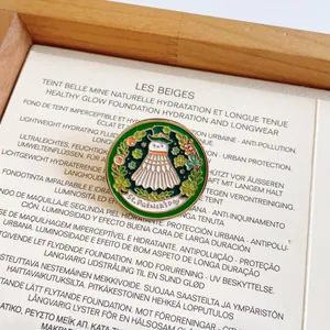 Macro detail of a creative shuttlecock enamel pin featuring a St. Patrick's Day theme