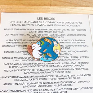 Detailed view of an enamel rabbit brooch featuring Mid-Autumn Festival motifs on blue background