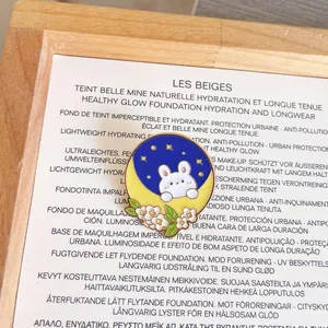 Detailed close-up of a cute rabbit on crescent moon enamel pin brooch with flowers