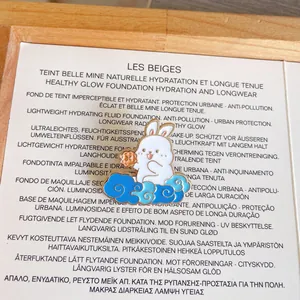 Close-up of a cute cartoon rabbit enamel pin on blue clouds for Mid-Autumn Festival.