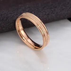 Detailed close-up showing the frosted sandblasted texture of this rose gold ring