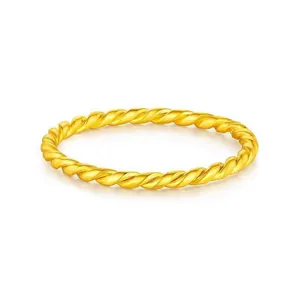 Minimalist twisted rope titanium steel ring in gold finish for elegant daily wear