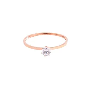 Minimalist rose gold titanium steel ring featuring a sparkling single round zircon