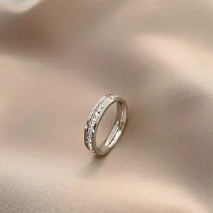 Detailed macro view of an elegant silver titanium steel ring with full sparkling crystals