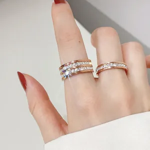 Elegant rose gold titanium steel eternity rings with full pavé cubic zirconia for women.