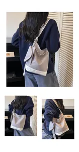 Close-up details of a stylish contrast color canvas tote bag for daily casual use
